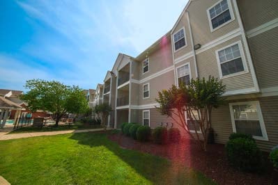 An outdoor view of the ELS Nashville Student Residence building and yard space.