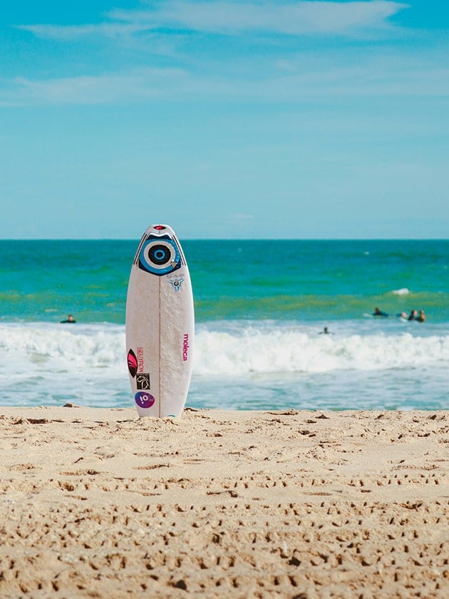 A surfboard in the sand at Sebastian Inlet State Park beach near Melbourne, Florida, USA,  home to ELS Language Centers.